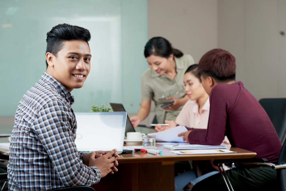 young-asian-man-sitting-meeting-table-work